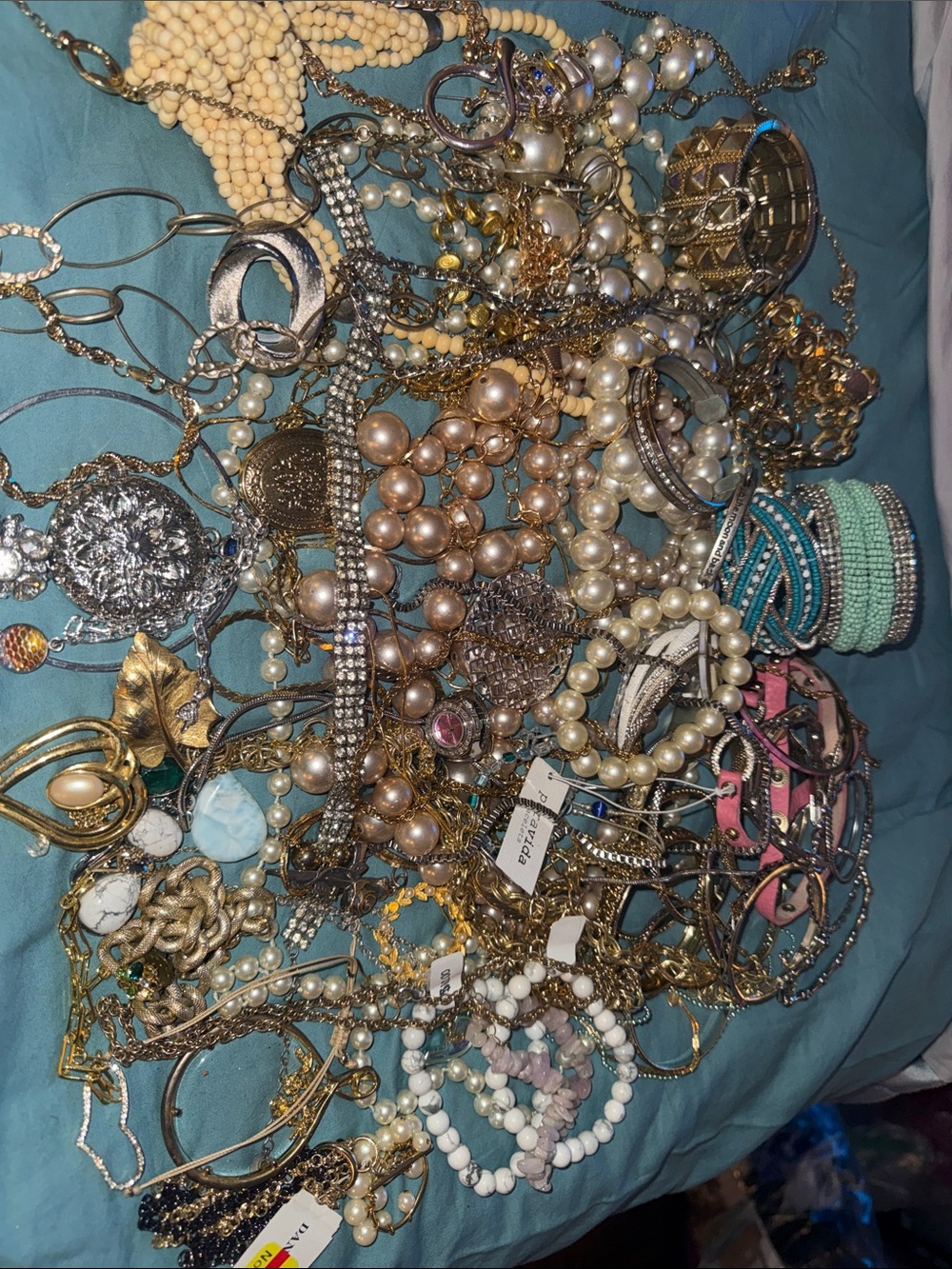 Shades of pearls and gold and silver jewelry for resale